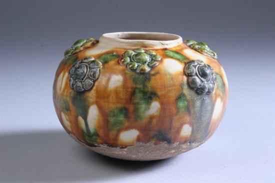 Appraisal: CHINESE SANCAI POTTERY JAR Tang dynasty Molded with eight flower-heads