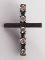 Appraisal: An oxidise white metal tests carat gold diamond cross pendant