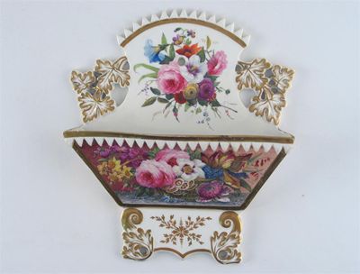 Appraisal: A Coalport letter rack moulded with leaves and painted with