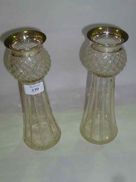 Appraisal: A PAIR OF CUT GLASS VASES of stylised tapering form