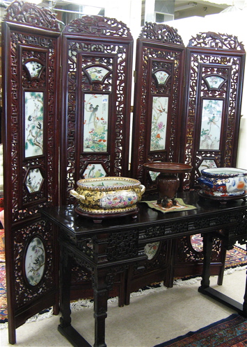 Appraisal: CARVED ROSEWOOD AND FAMILLE VERTE PORCELAIN FLOOR SCREEN Chinese th