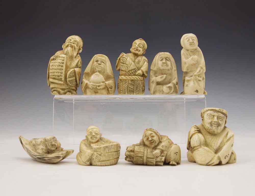 Appraisal: PIECE CARVED BONE NETSUKE Assorted figures are signed Largest measures