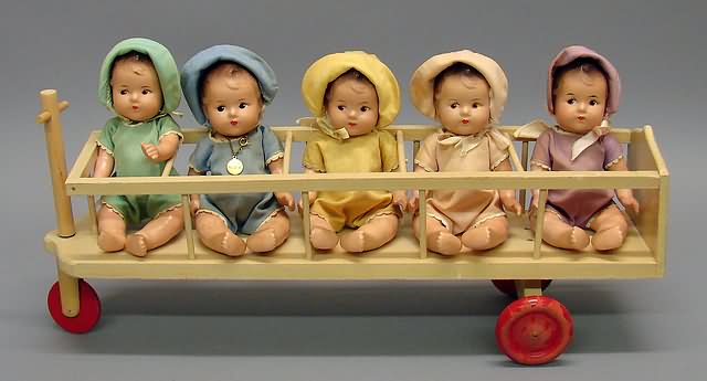 Appraisal: Set of Alexander compo Dionne Quintuplets in kiddie car Dolls