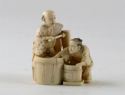 Appraisal: A Japanese ivory carving of two figures at work over