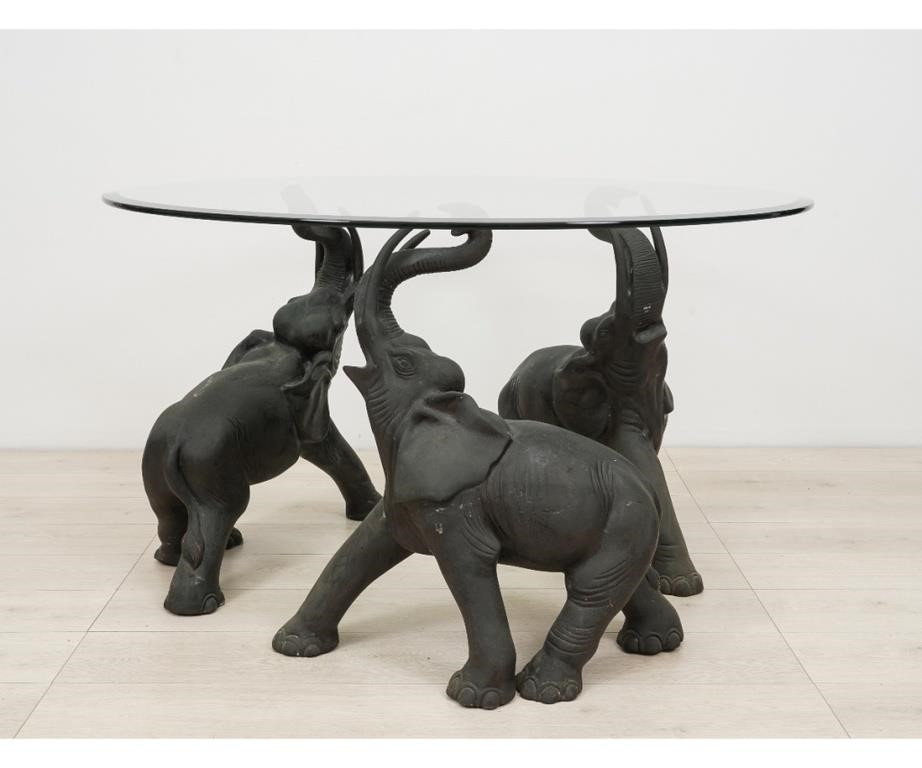 Appraisal: Free standing bronze three elephant table with beveled glass top