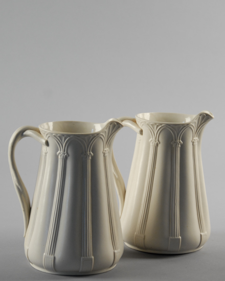 Appraisal: A Pair of Continental Salt Glaze Ionic Capital Pitchers with