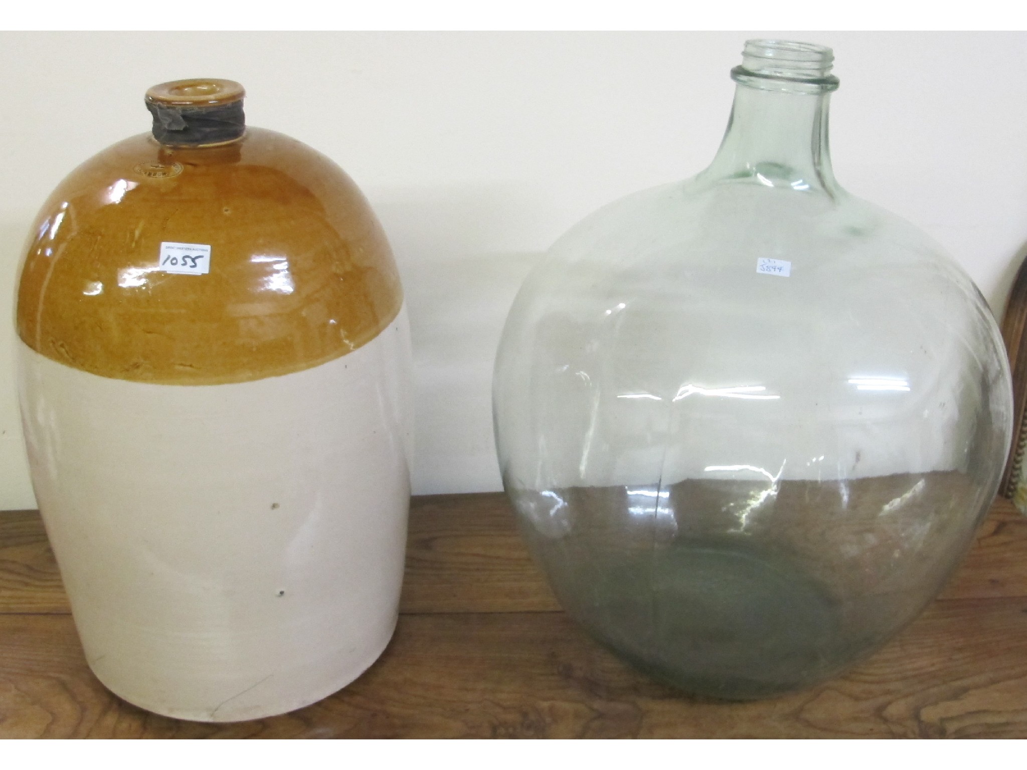 Appraisal: A large glass jar and a stoneware jar by Possil