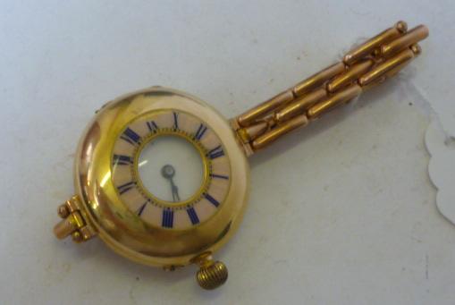 Appraisal: A LADY'S CT GOLD WRISTWATCH of half hunter form the