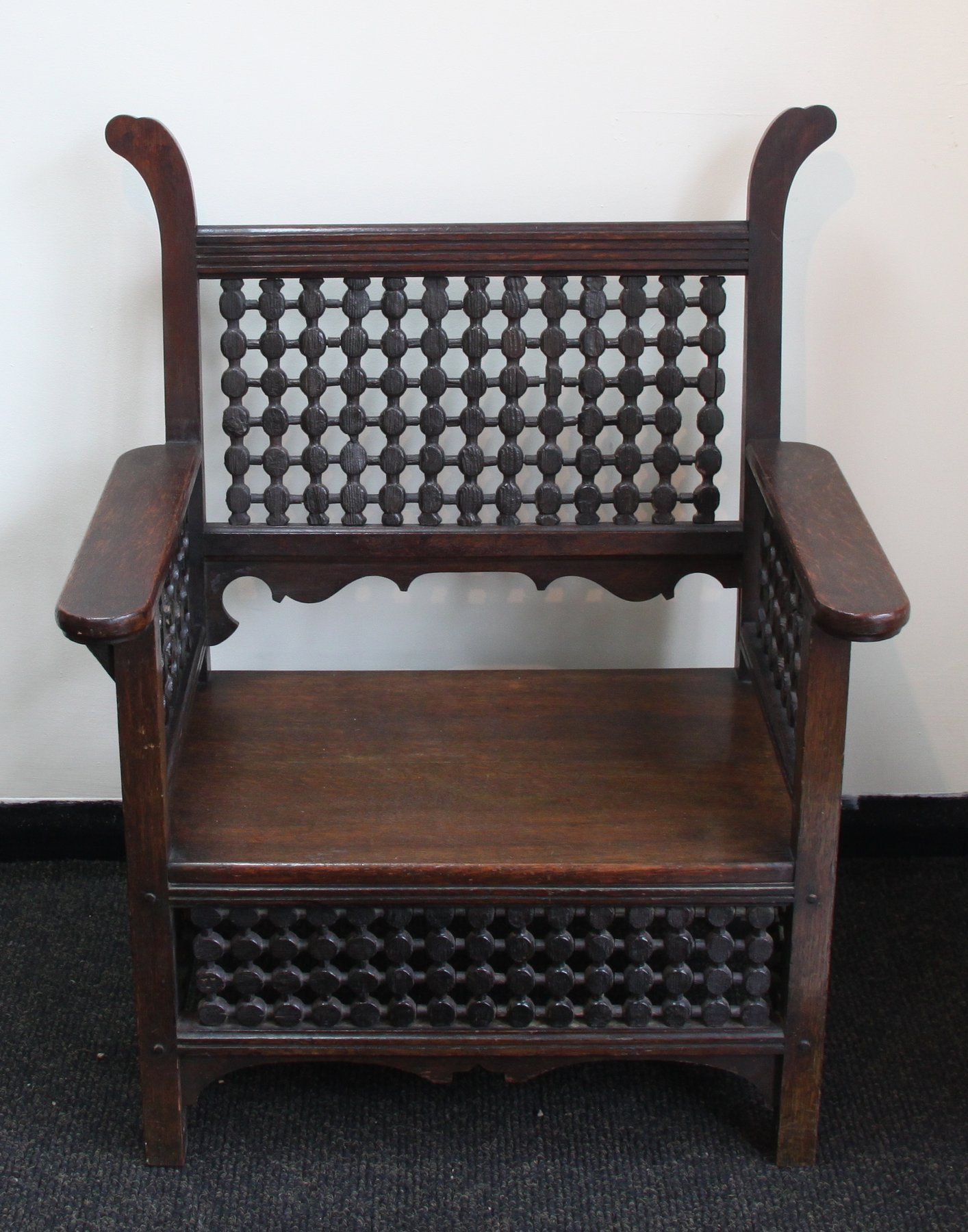 Appraisal: An Arts and Crafts type oak armchair in the style