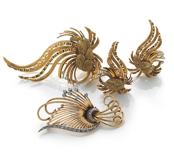 Appraisal: A collection of diamond and gold jewelry comprising two brooches