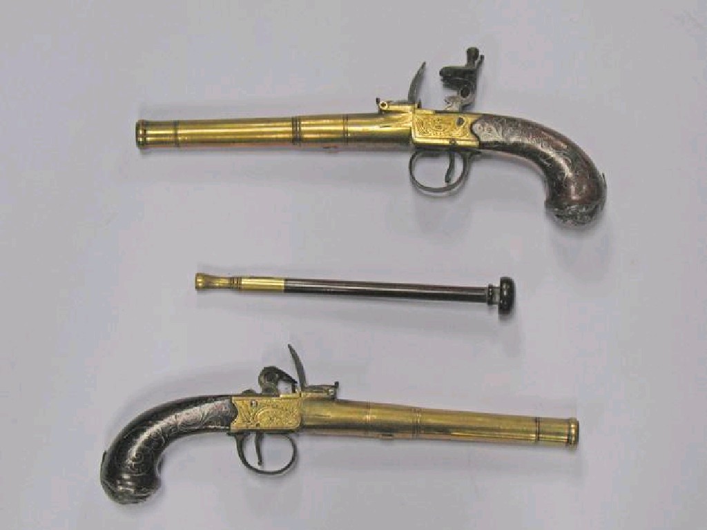 Appraisal: A PAIR OF TH CENTURY DUELLING PISTOLS with brass barrels