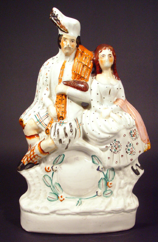 Appraisal: Large hand painted Staffordshire flat back group a Scotsman and