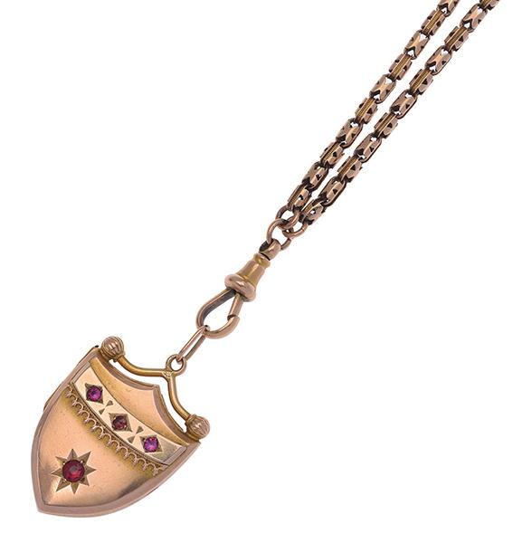 Appraisal: AN ANTIQUE GOLD LOCKET AND MUFF CHAIN Four garnet topped