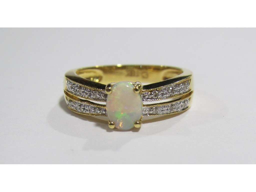 Appraisal: Eighteen carat gold opal and diamond set dress ring