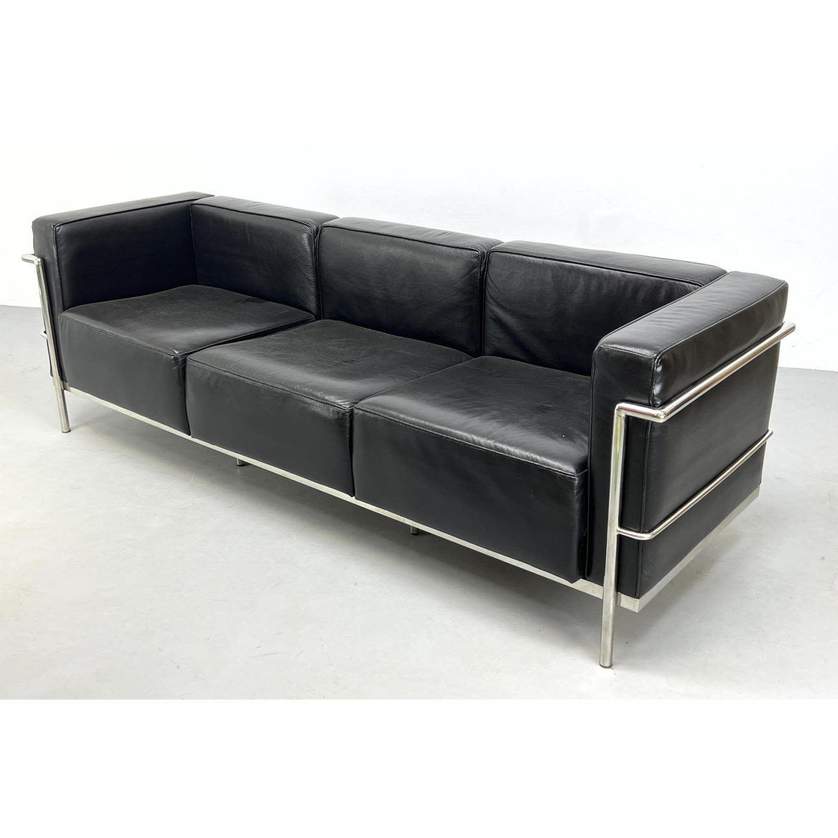 Appraisal: Le Corbusier style black vinyl sofa with chrome frame Unsigned