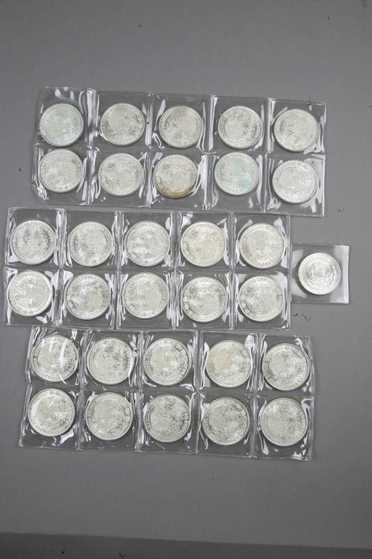 Appraisal: THIRTY-ONE SILVER MEXICAN COINS Thirty are one hundred peso coins