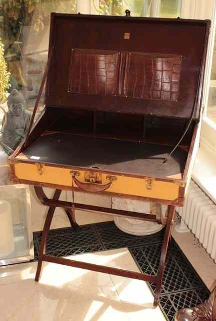 Appraisal: A CANVAS COVERED LEATHER MOUNTED WRITING DESK in the form