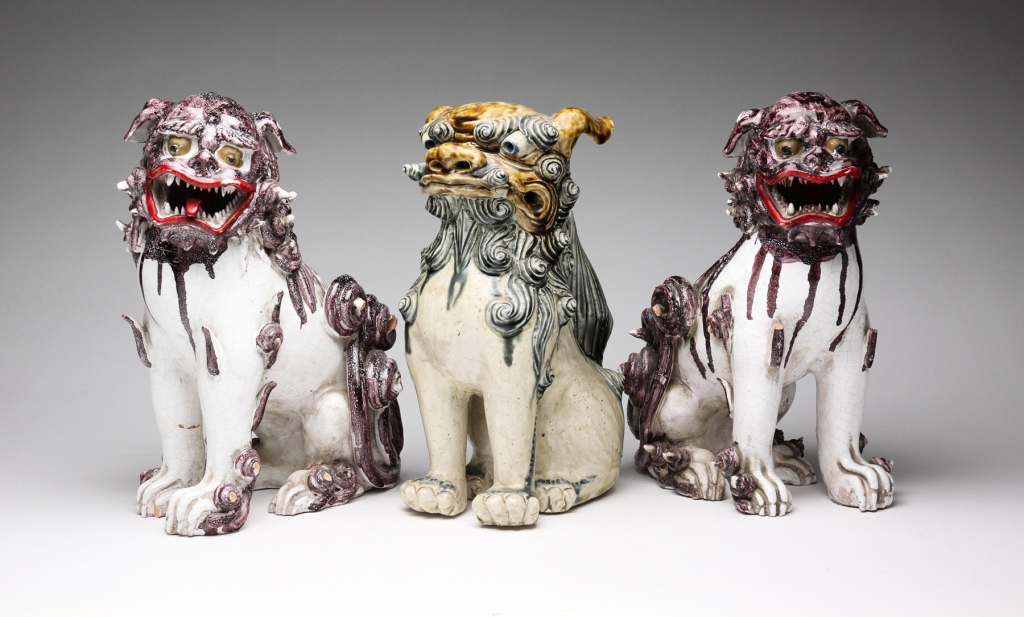 Appraisal: Mid th century Pair of white and purple faience dogs