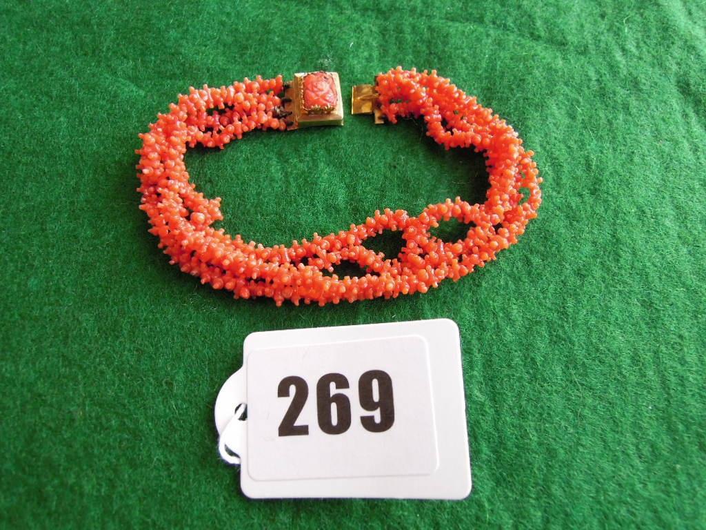 Appraisal: A four strand coral bracelet to the th century yellow