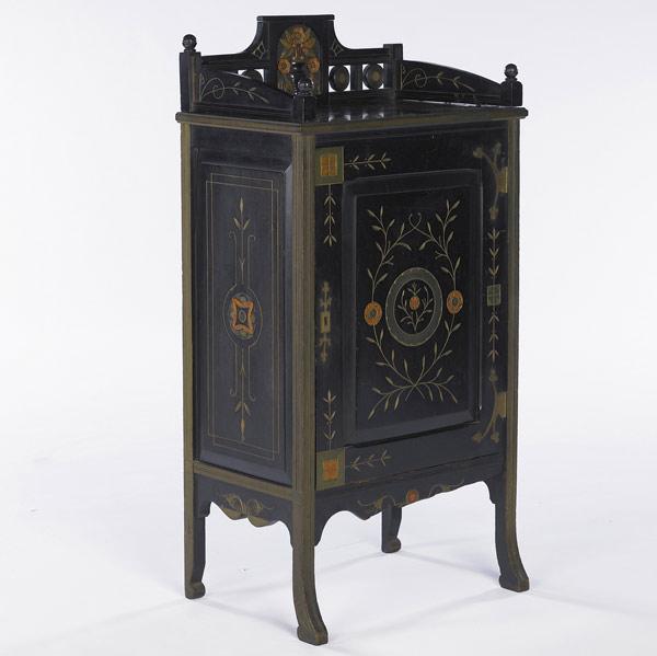 Appraisal: CONTINENTAL CABINET Ebonized music cabinet with gallery top and incised