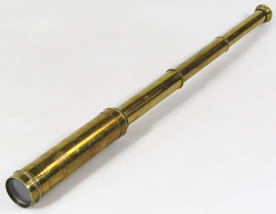 Appraisal: An early thC brass three draw telescope with articulated cylindrical