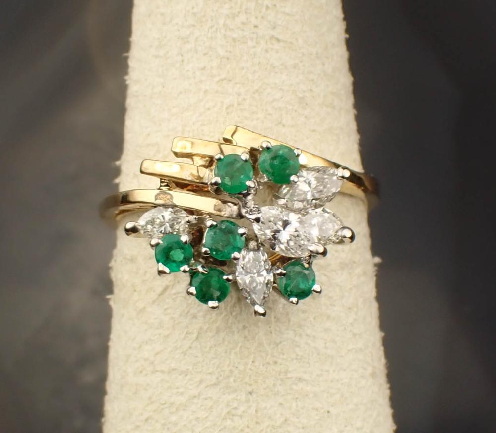 Appraisal: DIAMOND EMERALD AND EIGHTEEN KARAT GOLD RING The yellow gold