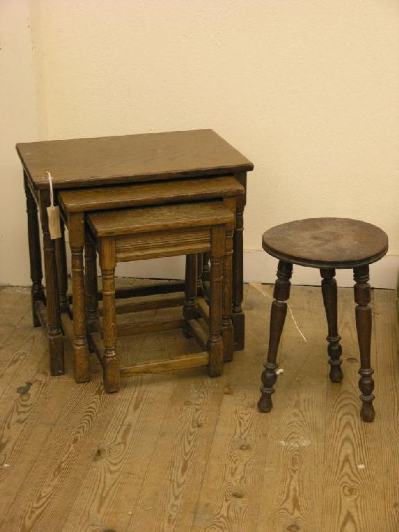 Appraisal: A nest of three oak tables on baluster turned underframes