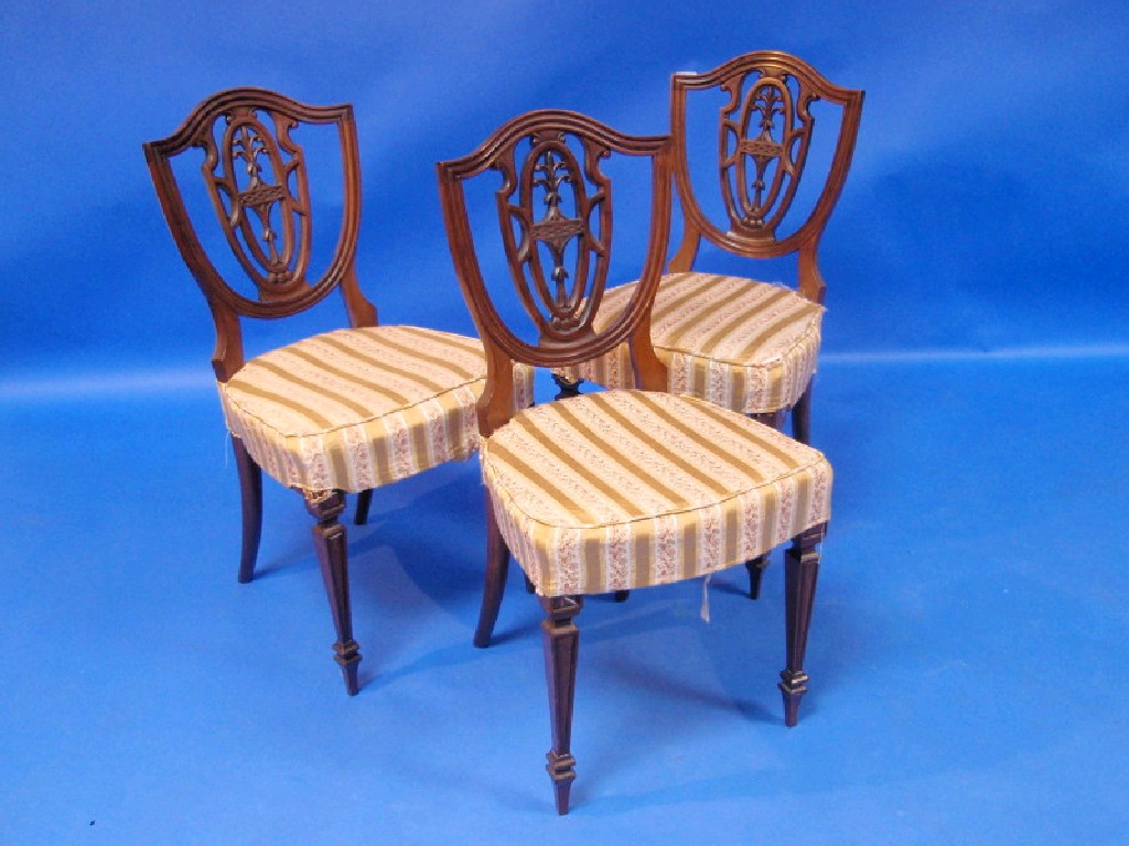 Appraisal: Set of three mahogany occasional chairs with shield-shaped backs and