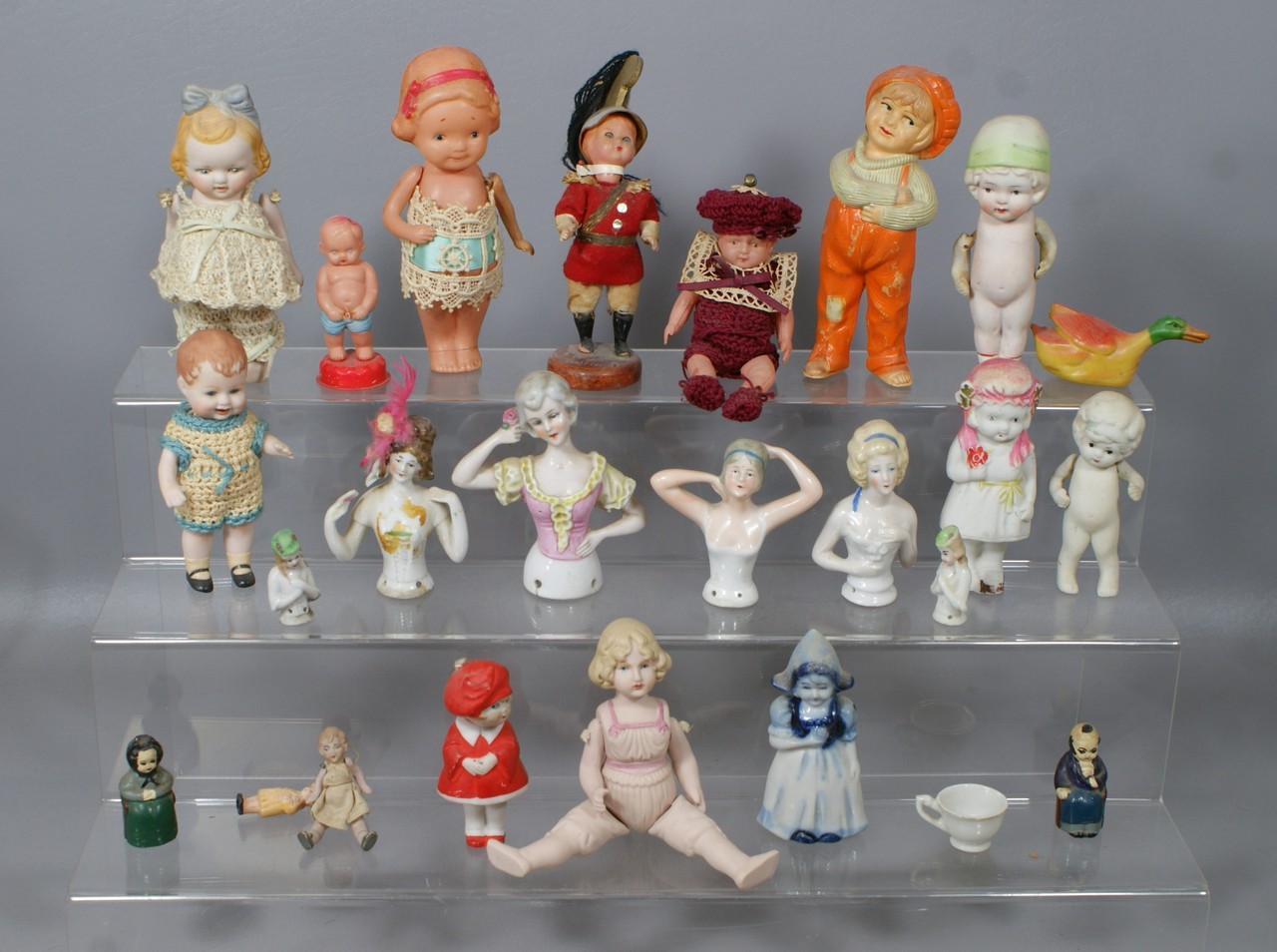 Appraisal: assorted small dolls and pin cushion half dolls mostly bisque