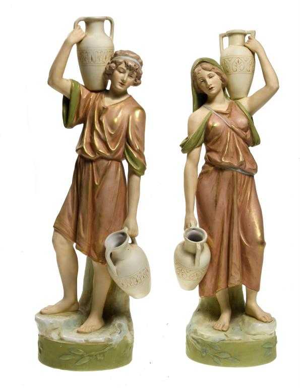 Appraisal: A PAIR OF ROYAL DUX FIGURES OF WATER CARRIERS the