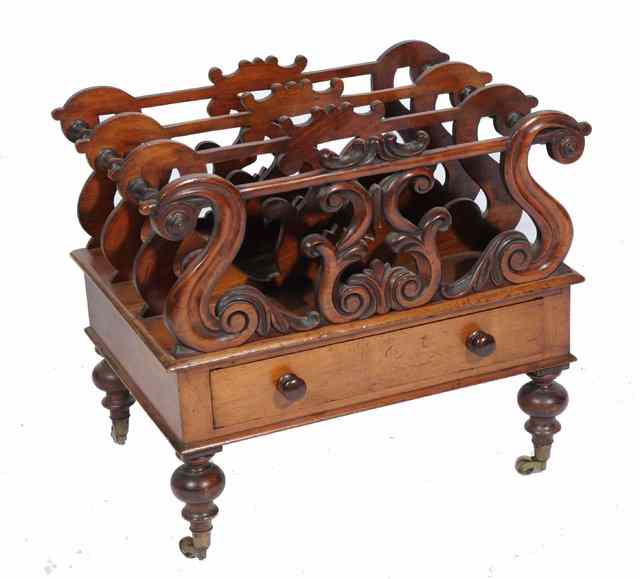 Appraisal: A TH CENTURY WALNUT CANTERBURY with scroll decoration and drawer