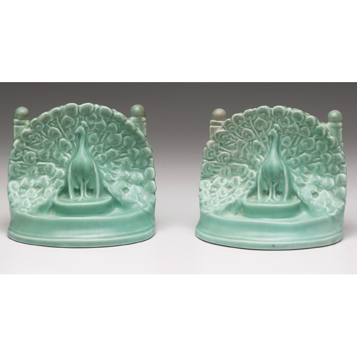 Appraisal: Rookwood bookends pair peacock under a turquoise matt glaze w