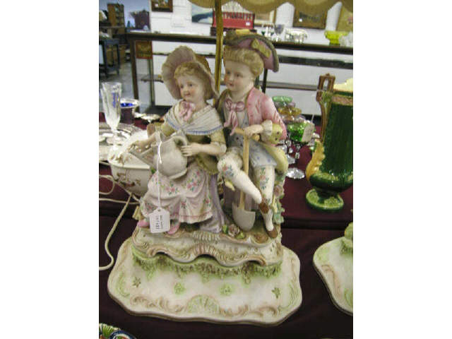 Appraisal: Figural Bisque Lamp French boy girl gardening