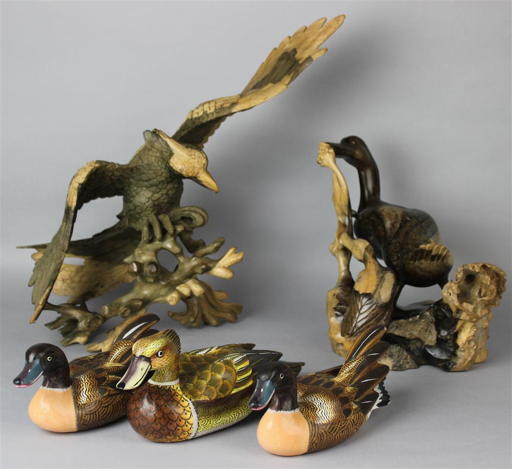 Appraisal: INDONESIAN WOOD DUCK GROUP carved as a duck and her