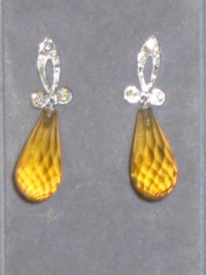 Appraisal: A PAIR OF DIAMOND AND CITRINE EARRINGS the pierced diamond