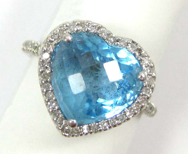 Appraisal: BLUE TOPAZ AND DIAMOND RING k white gold with round-cut