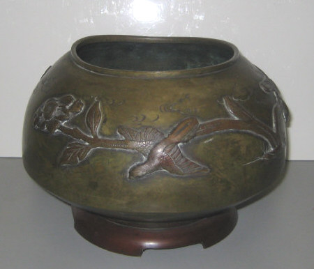 Appraisal: JAPANESE BRONZE VASE Footed squad circular with applied brown patinated