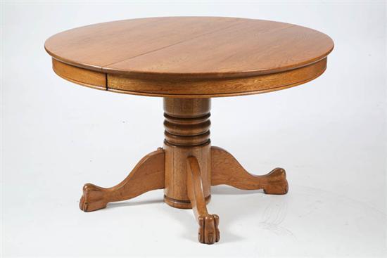 Appraisal: PEDESTAL TABLE Round oak table on a turned baluster with