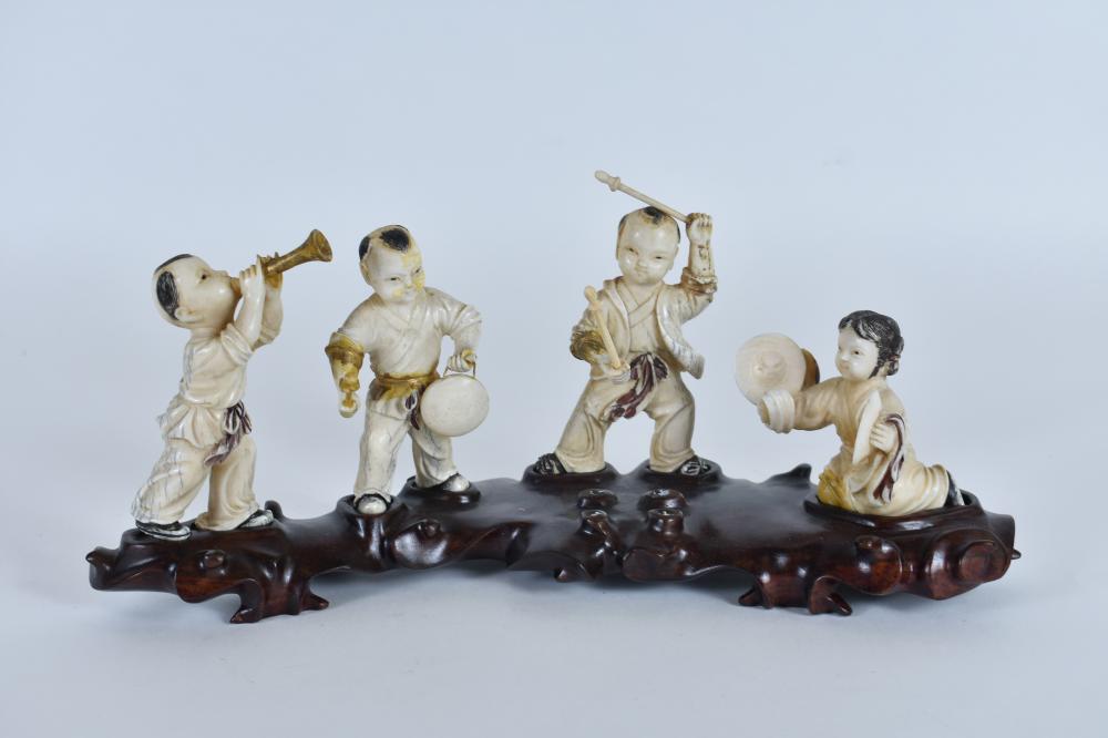 Appraisal: CHINESE CARVED SET OF FOUR ADOLESCENT MUSICIANSEach poised with an