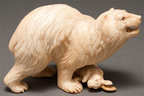 Appraisal: Continental carved ivory figure of a bear standing over prey