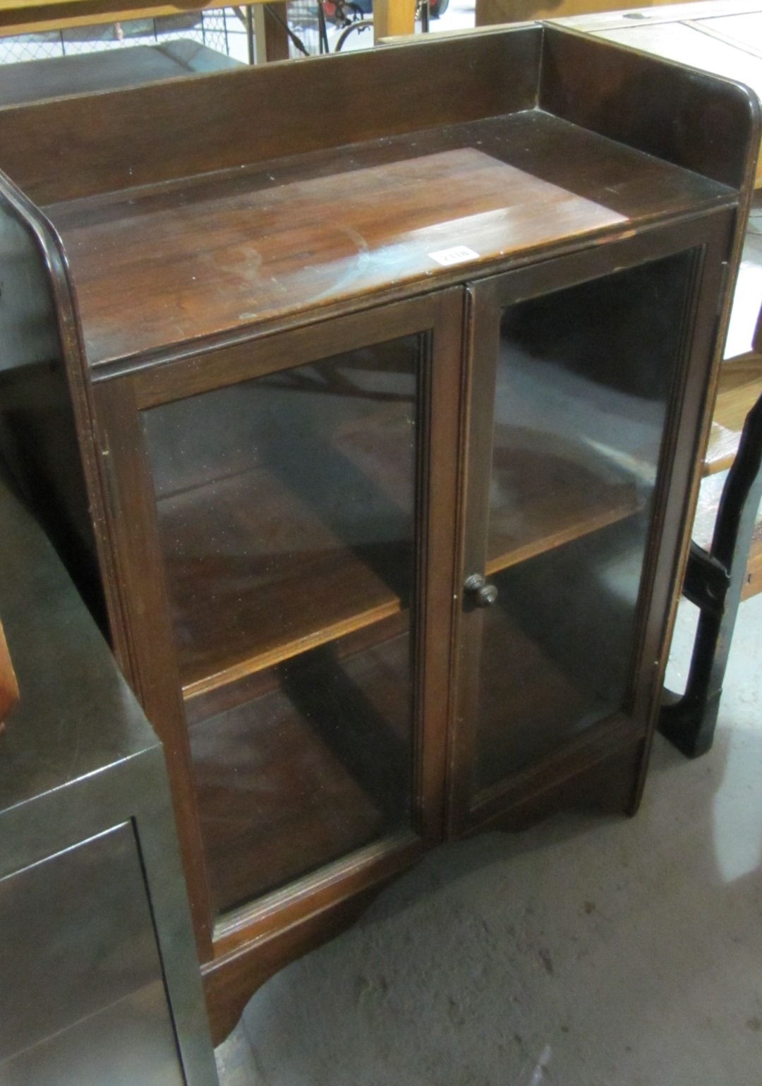 Appraisal: A th century mahogany small glazed two door bookcase