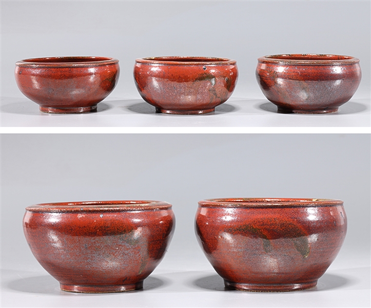 Appraisal: Five Chinse early style sang de boeuf glazed bowls overall