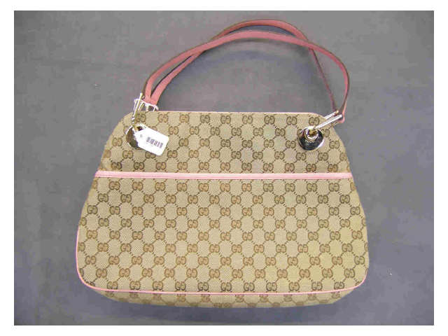 Appraisal: Gucci handbag with Gucci logo fabric with pink leather trip