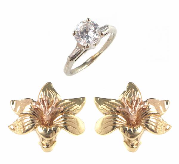 Appraisal: A pair of gold floral earrings with a cubic zircon