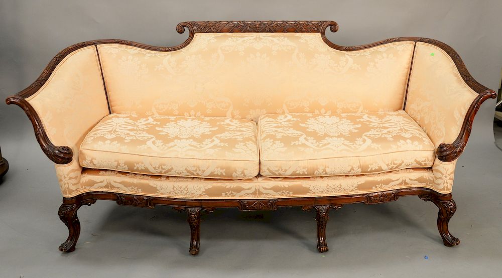 Appraisal: Carved mahogany upholstered sofa sunfaded lg in Carved mahogany upholstered