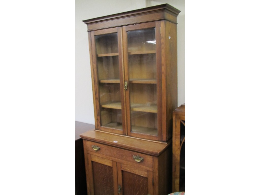 Appraisal: Victorian oak bookcase on cupboard base