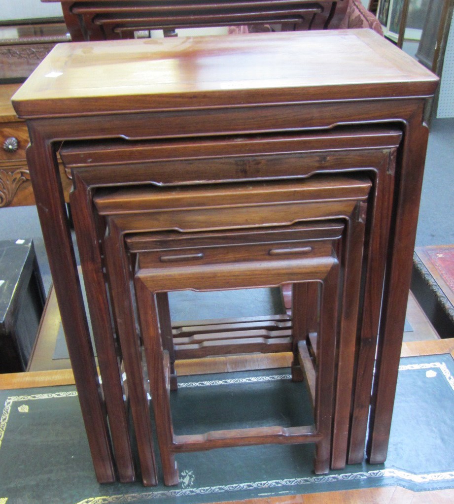 Appraisal: A nest of four Chinese hongmu occasional tables on block