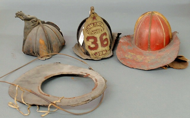 Appraisal: Three leather firemen s helmets one with Germantown Hose As