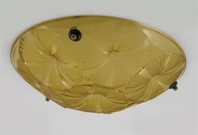 Appraisal: A Degue Art Deco amber glass ceiling shade cast with