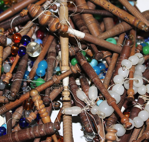 Appraisal: A COLLECTION OF ANTIQUE TURNED WOODEN BEADED LACE BOBBINS